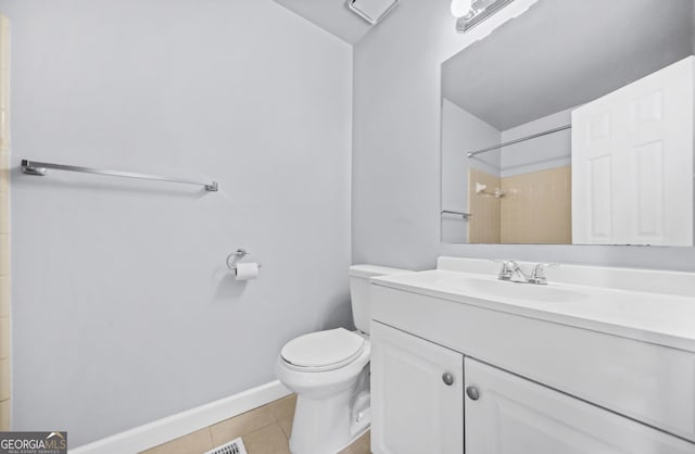 bathroom with walk in shower, vanity, toilet, and tile patterned flooring