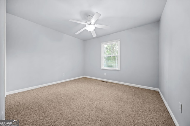 empty room with carpet and ceiling fan