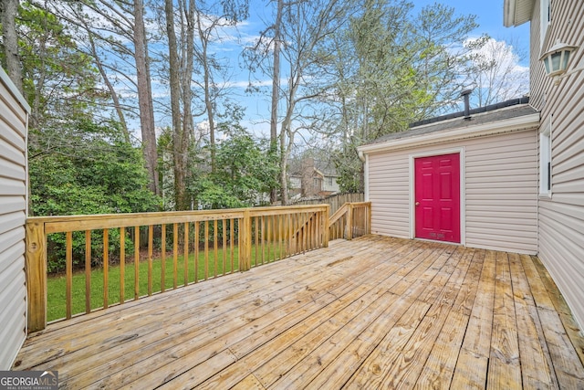 wooden deck featuring a yard