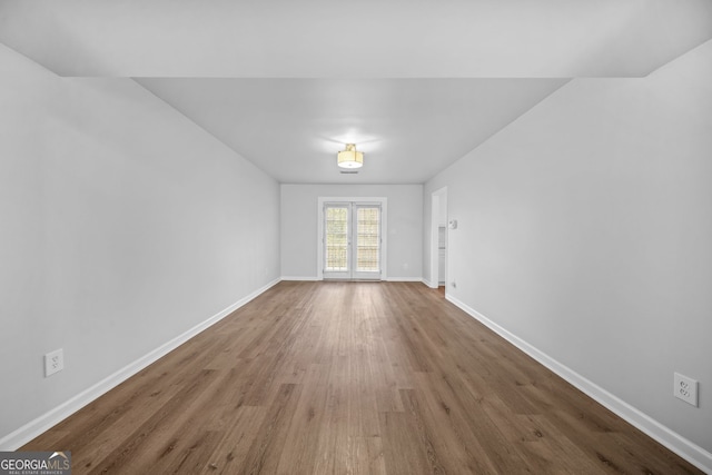 empty room with wood-type flooring