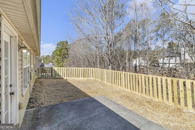 view of yard with a fenced backyard and a patio