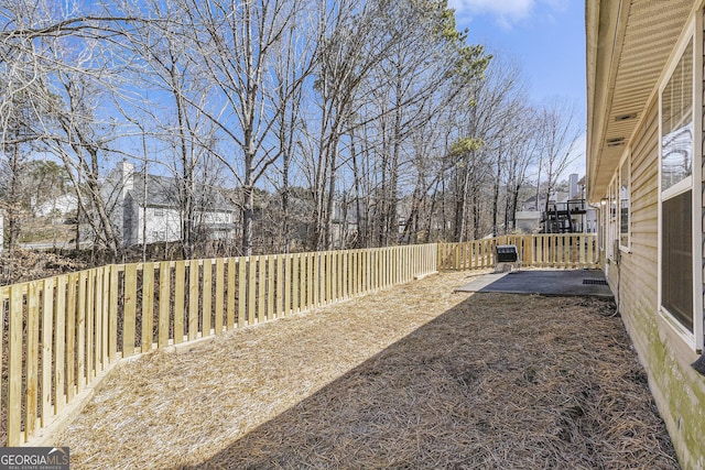 view of yard with a fenced backyard and a patio