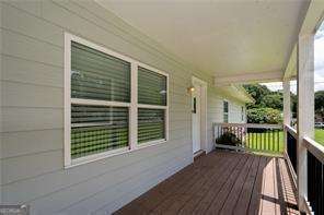 wooden deck featuring covered porch