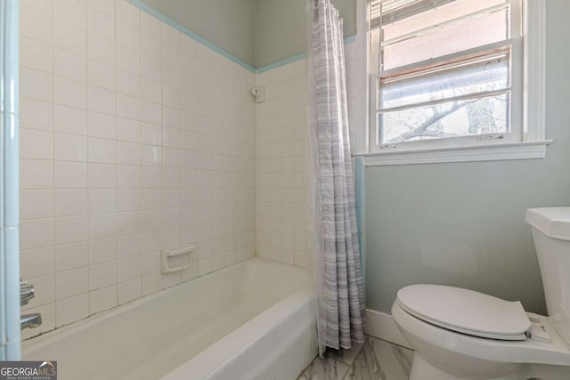 bathroom featuring shower / tub combo with curtain and toilet