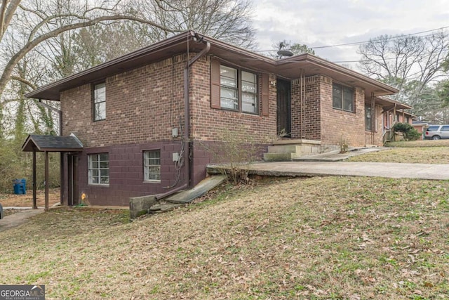 view of side of home featuring a yard