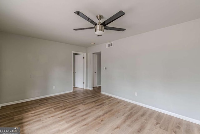 unfurnished room with ceiling fan and light hardwood / wood-style floors