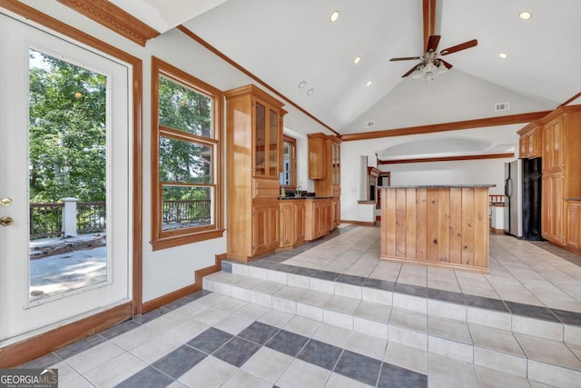 kitchen featuring stainless steel refrigerator, beamed ceiling, high vaulted ceiling, and light tile patterned floors