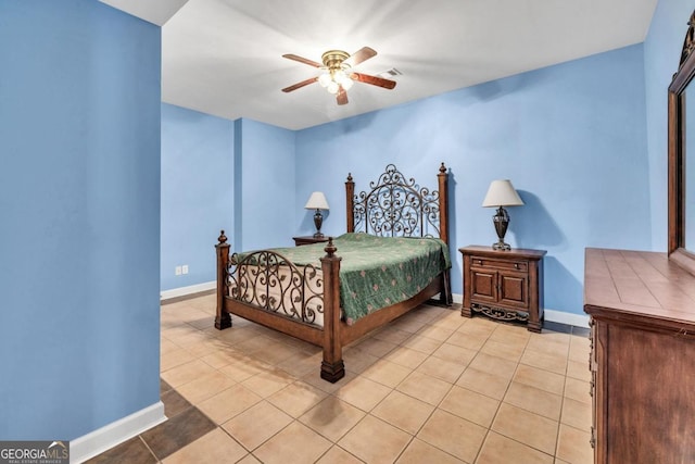 tiled bedroom with ceiling fan