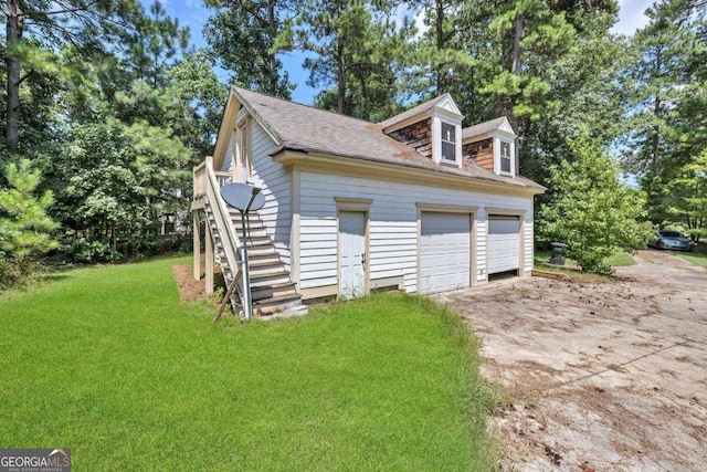 garage featuring a yard