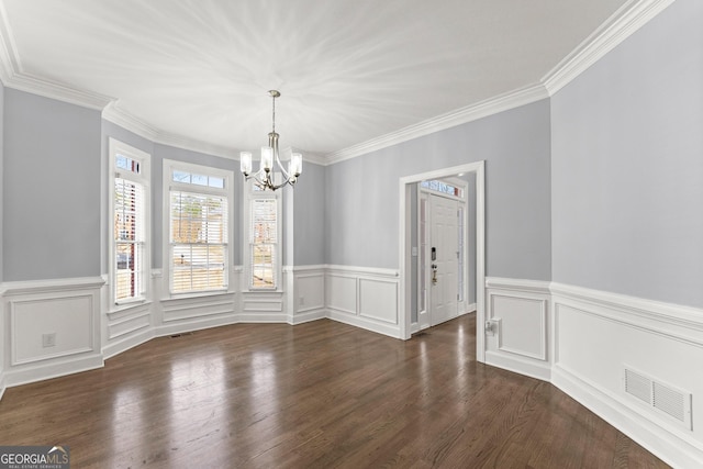 unfurnished dining area featuring ornamental molding, visible vents, dark wood finished floors, and a chandelier