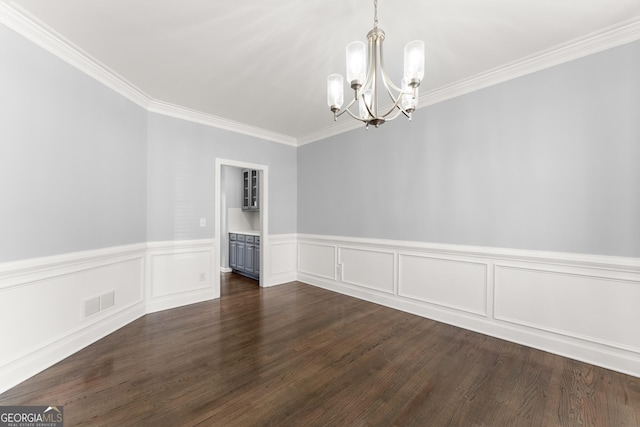 unfurnished dining area with an inviting chandelier, visible vents, dark wood-style flooring, and ornamental molding