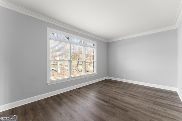 unfurnished room with visible vents, baseboards, dark wood finished floors, and crown molding