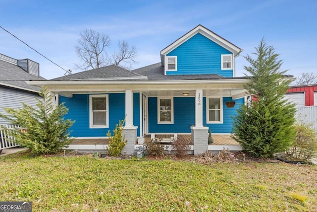 view of front facade with a porch and a front yard