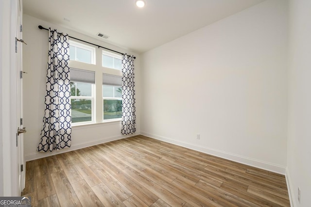 empty room with light wood-type flooring