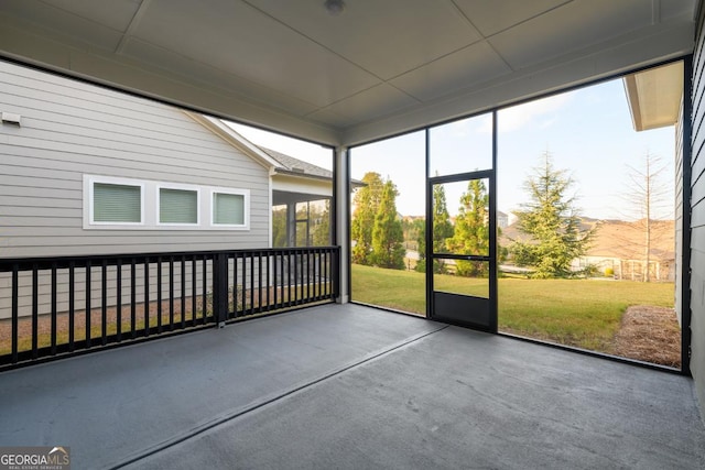 unfurnished sunroom featuring a mountain view