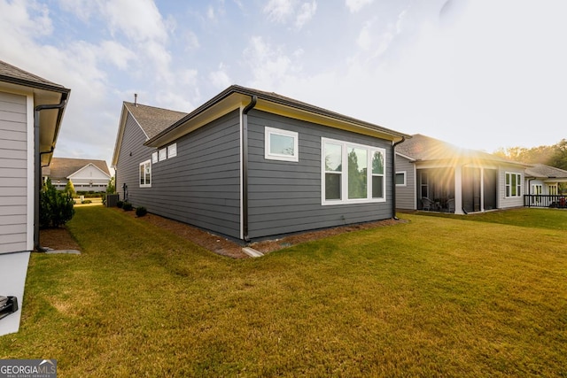 view of property exterior with cooling unit and a yard