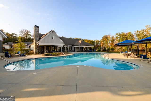 view of swimming pool with a patio