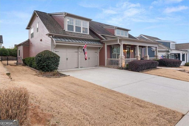 view of front facade featuring a garage and a porch