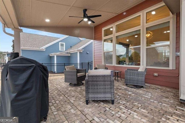 view of patio featuring an outdoor living space, a grill, and ceiling fan