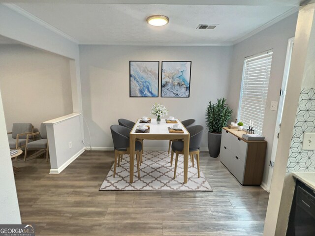 bedroom featuring ornamental molding and wood-type flooring