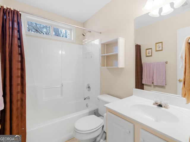 full bathroom featuring vanity, shower / bath combination with curtain, and toilet