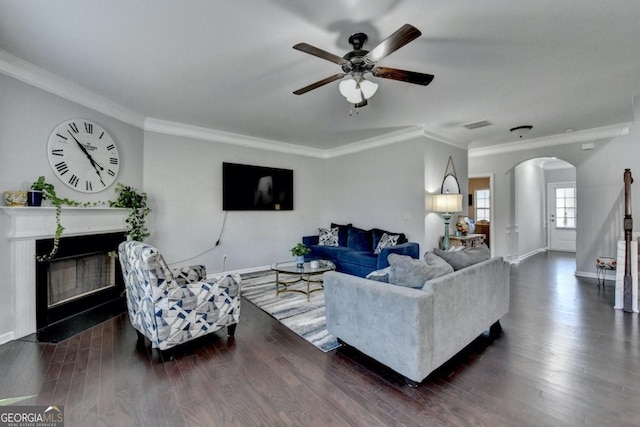 living room featuring crown molding, dark hardwood / wood-style floors, and ceiling fan