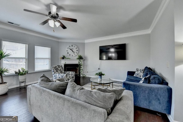 living room featuring ornamental molding, dark hardwood / wood-style floors, and ceiling fan