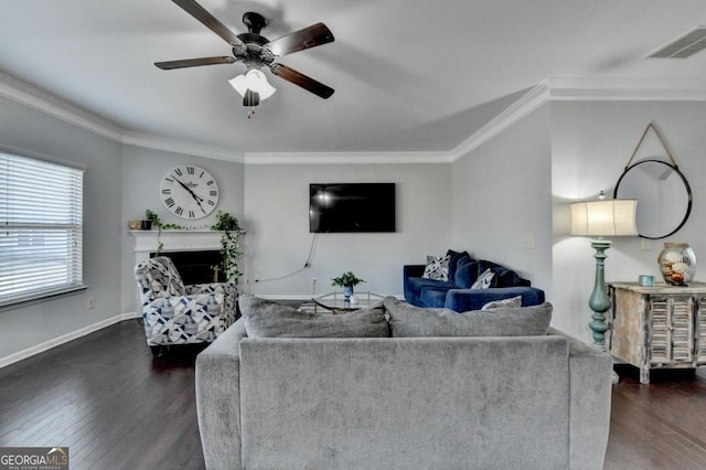 living room featuring dark wood-type flooring, ceiling fan, and crown molding