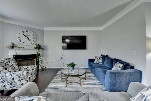 living room with ornamental molding and dark hardwood / wood-style floors