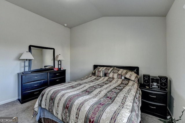 carpeted bedroom featuring vaulted ceiling