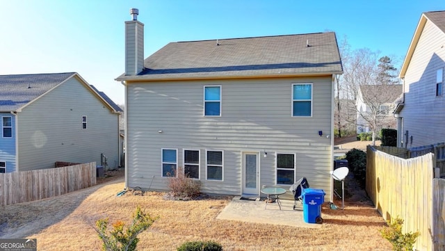 rear view of house with a patio