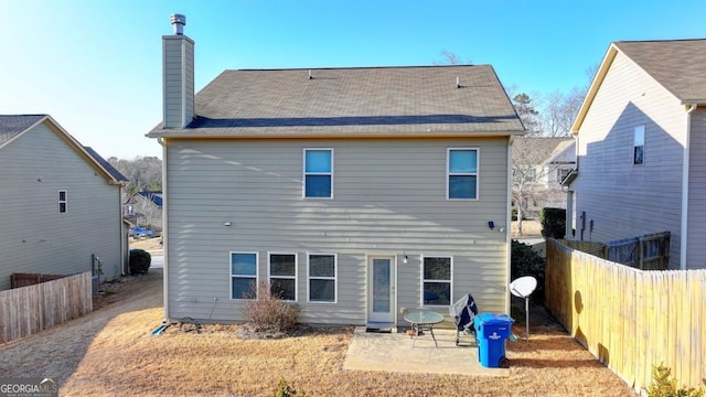 rear view of property with a patio area