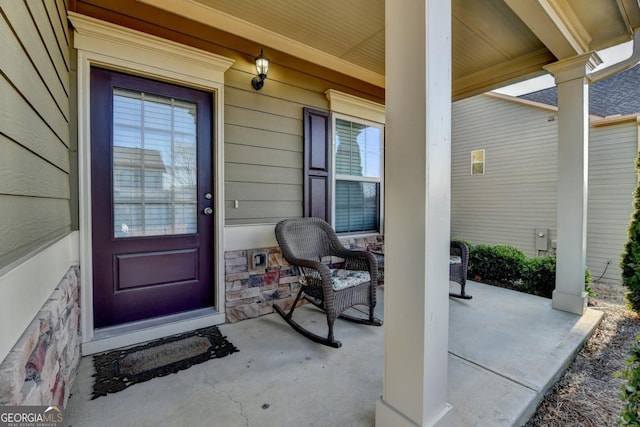 property entrance featuring a porch