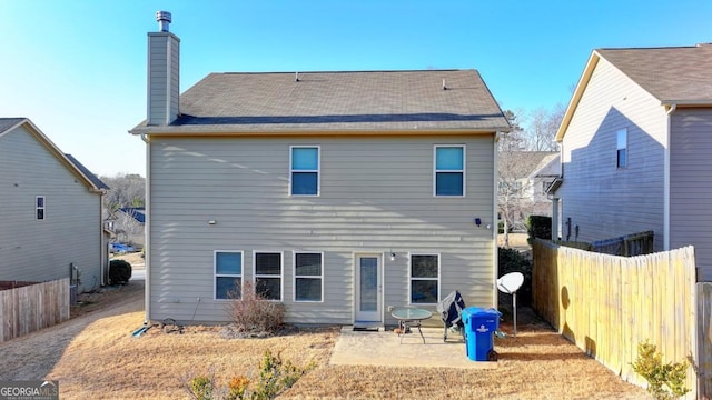 back of house with a patio area