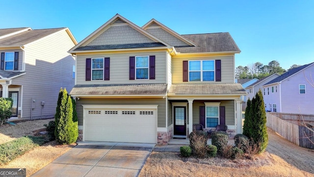 craftsman-style house featuring a porch and a garage