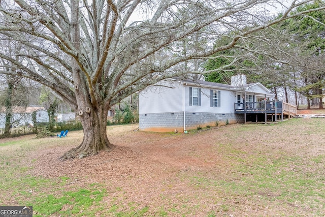 view of yard with a deck