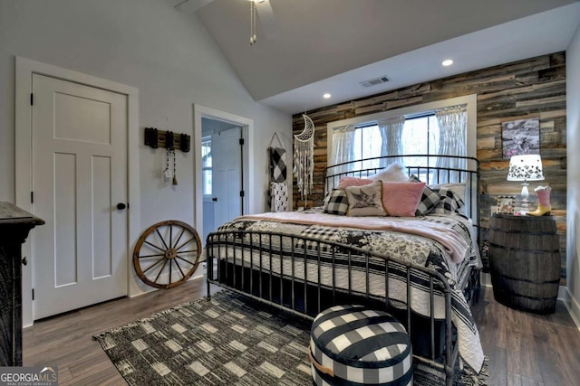 bedroom featuring high vaulted ceiling and hardwood / wood-style floors