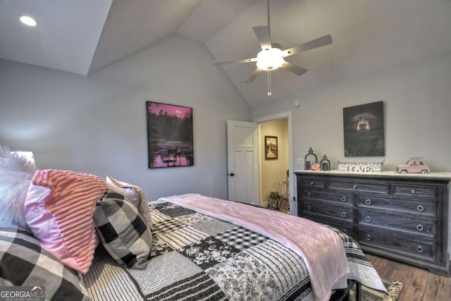 bedroom with ceiling fan, lofted ceiling, and dark hardwood / wood-style flooring