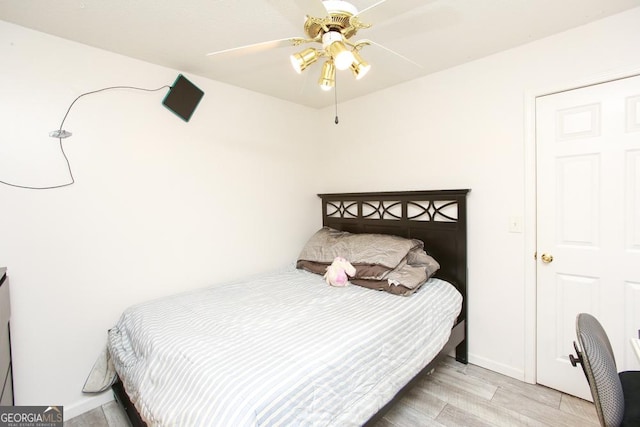 bedroom featuring ceiling fan and light hardwood / wood-style flooring