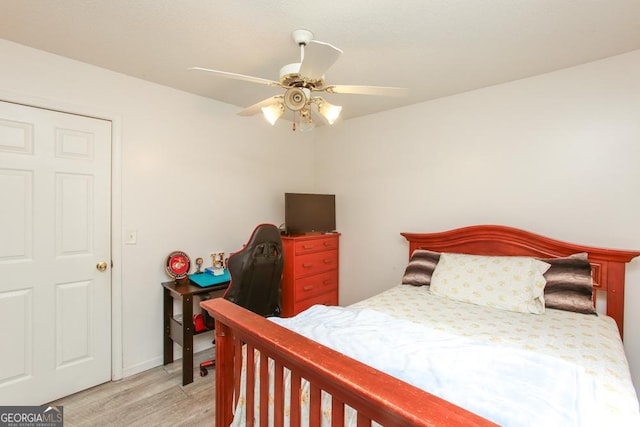 bedroom with ceiling fan and light hardwood / wood-style flooring