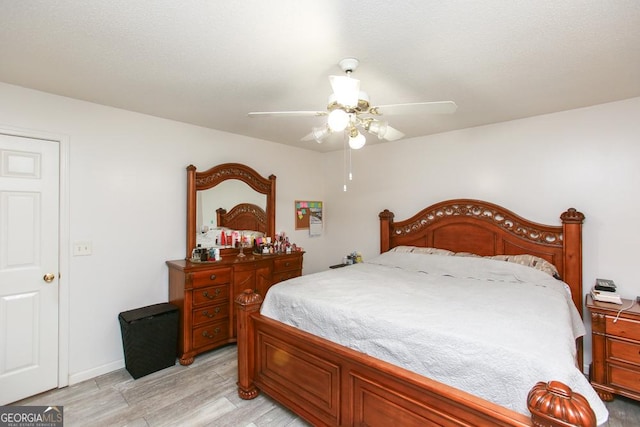 bedroom featuring ceiling fan and light hardwood / wood-style flooring