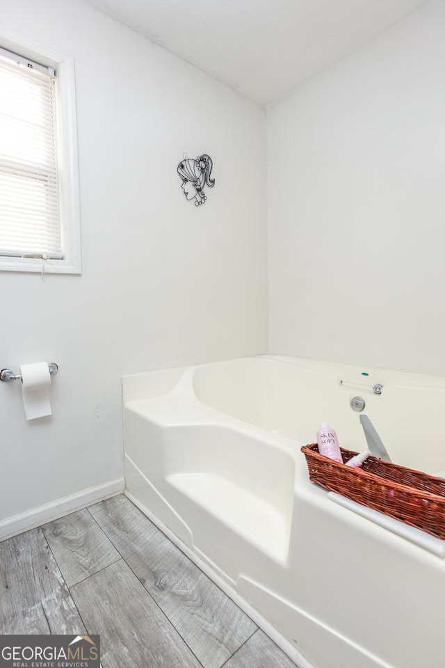 bathroom featuring a tub to relax in