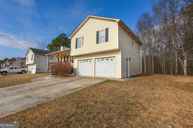 view of front of property featuring a garage, covered porch, and a front yard