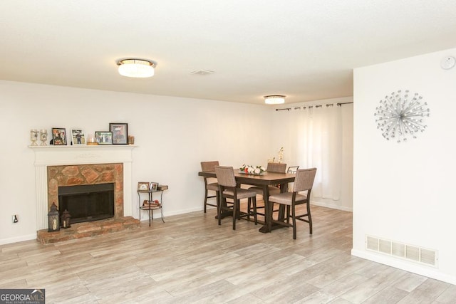 dining space with light wood-type flooring