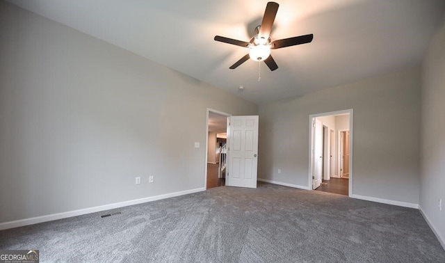 unfurnished bedroom featuring dark colored carpet and ceiling fan