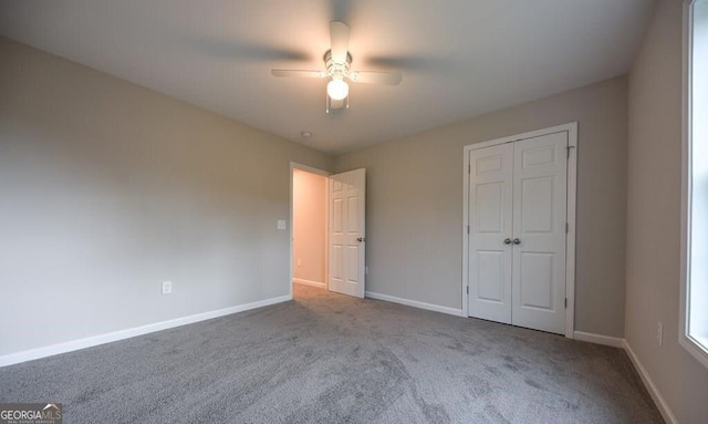 unfurnished bedroom with light carpet, a closet, and ceiling fan