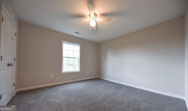 carpeted empty room with ceiling fan