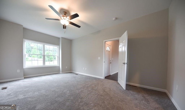 carpeted empty room with ceiling fan