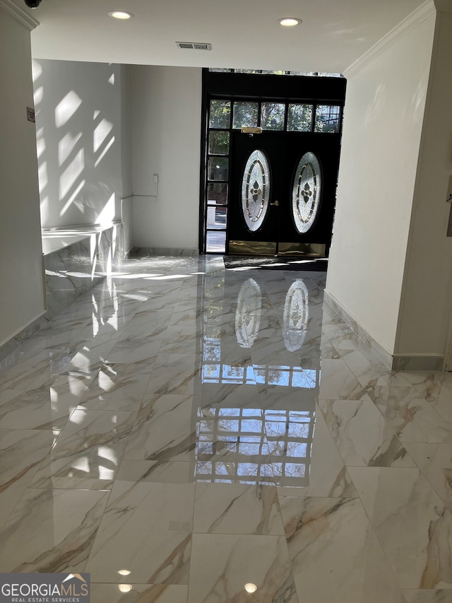 foyer with ornamental molding