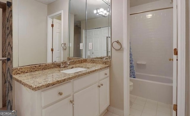 full bathroom featuring vanity, shower / bathtub combination with curtain, tile patterned floors, and toilet